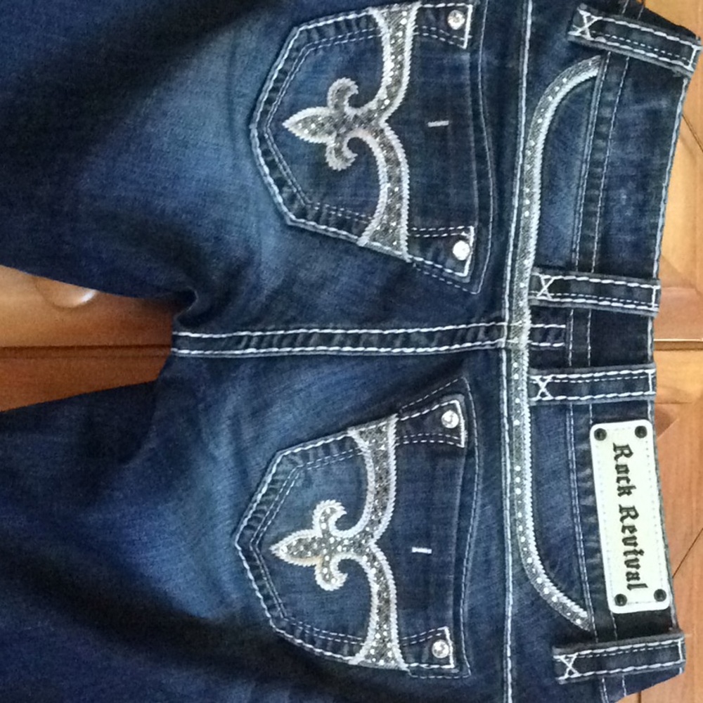 Like new Rock Revivals with light pink stitching